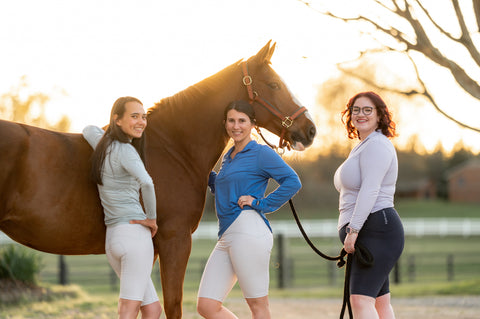 Women wearing riding underwear with a chestnut horse
